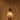 suspension en bois allumée avec lumière chaude et motif de rayons au plafond