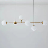 suspension moderne, suspension table à manger, suspension cuisine noire, suspension cuisine dorée, suspension au-dessus îlot