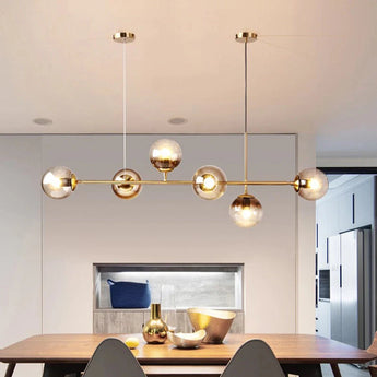 suspension moderne, suspension table à manger, suspension cuisine noire, suspension cuisine dorée, suspension au-dessus îlot