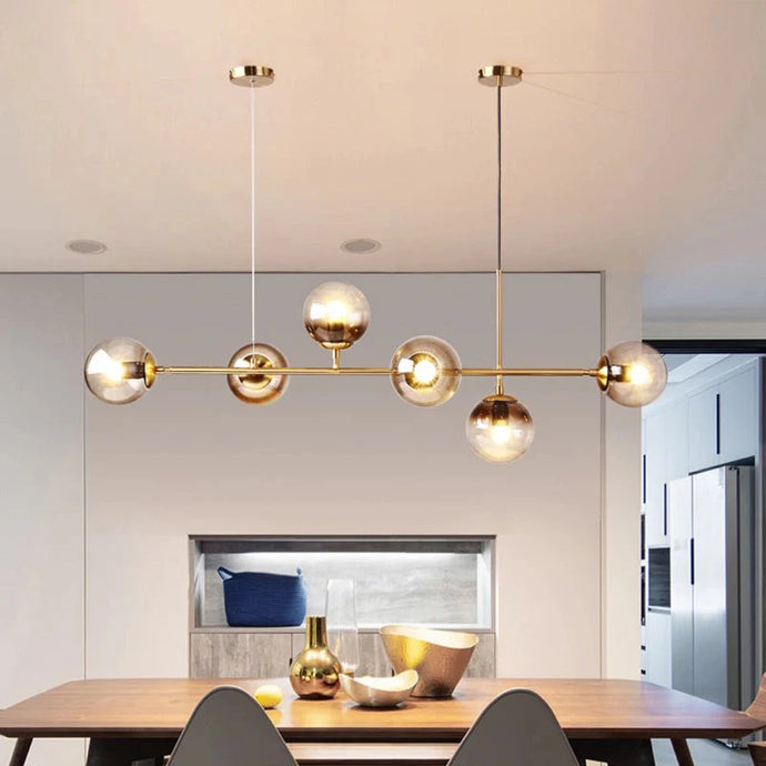 suspension moderne, suspension table à manger, suspension cuisine noire, suspension cuisine dorée, suspension au-dessus îlot