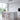 suspension cuisine noire, suspension LED intégrée, suspension design courbé, suspension dimmable cuisine, luminaire îlot de cuisine